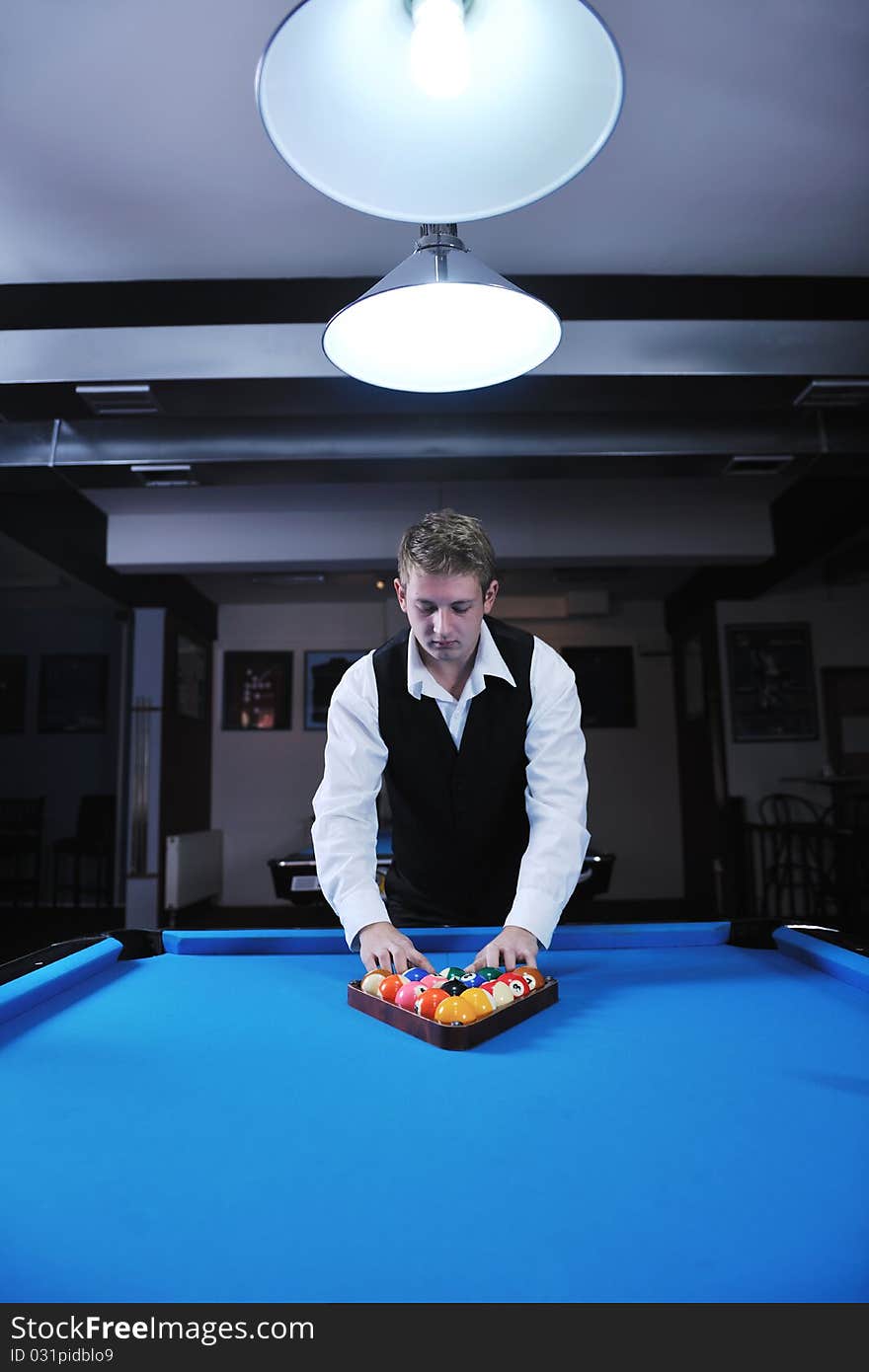 Young man play pro billiard game