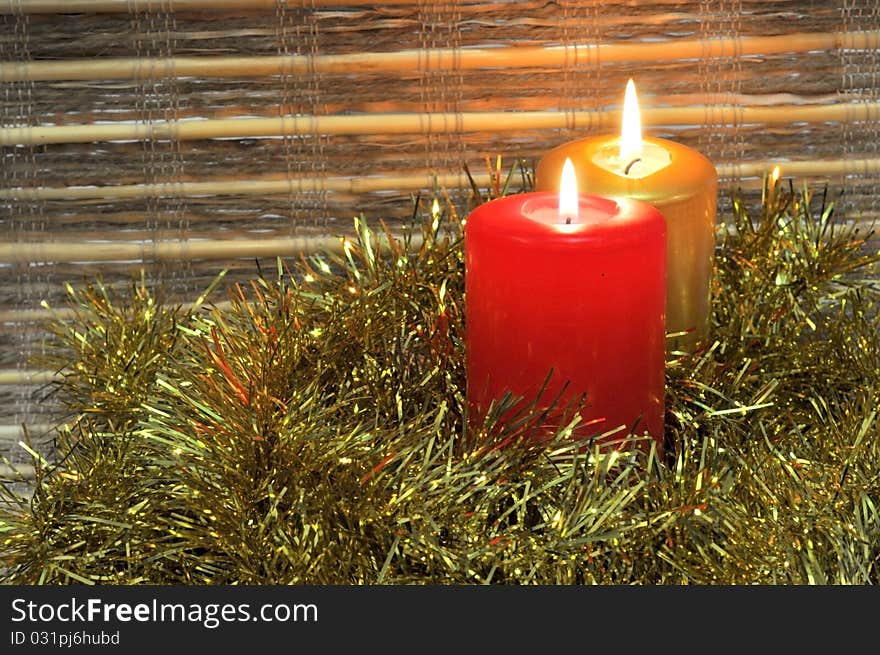 Lit candles with christmas golden decoration. Lit candles with christmas golden decoration