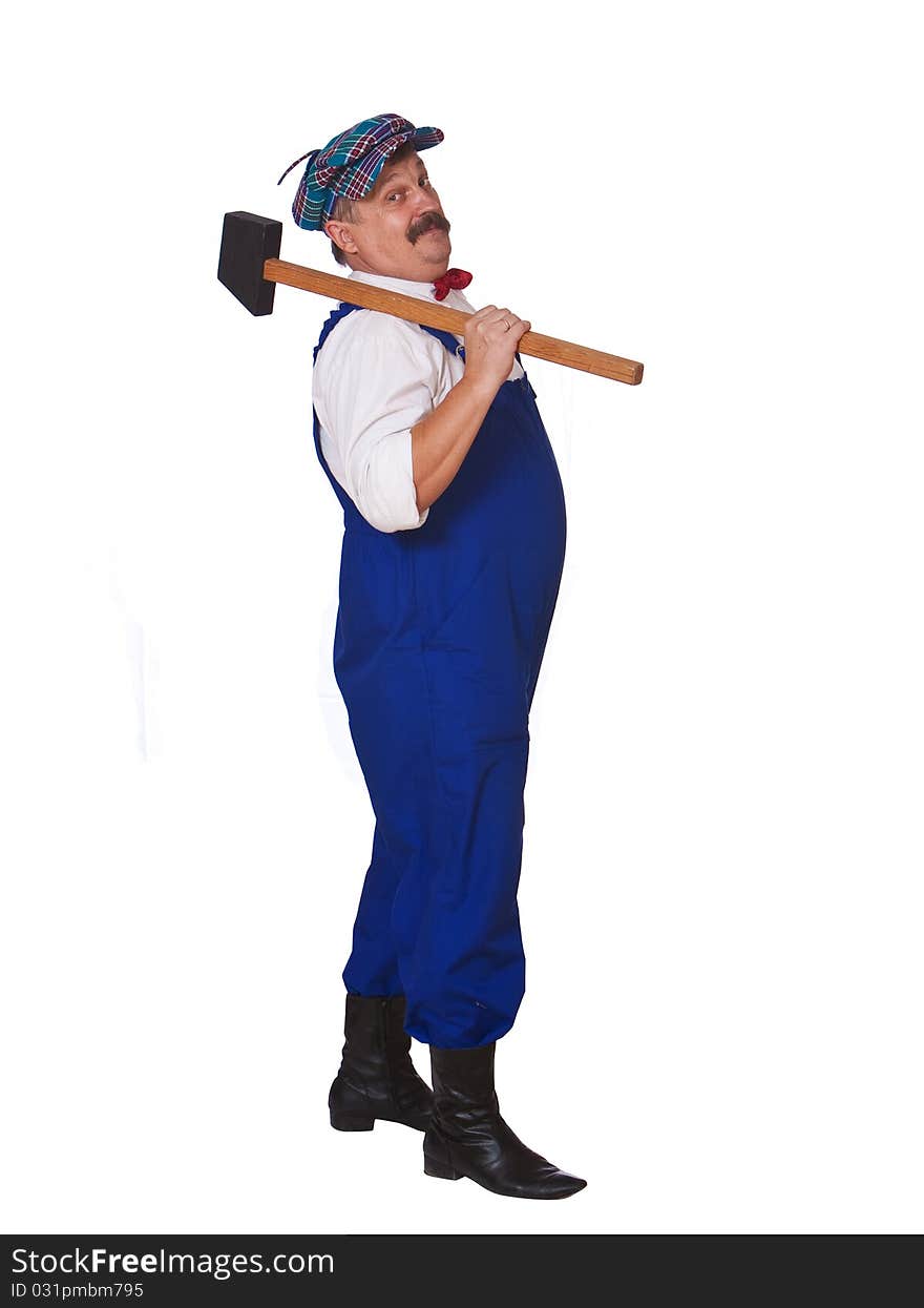 Cheerful worker in overalls with a hammer isolated. Cheerful worker in overalls with a hammer isolated