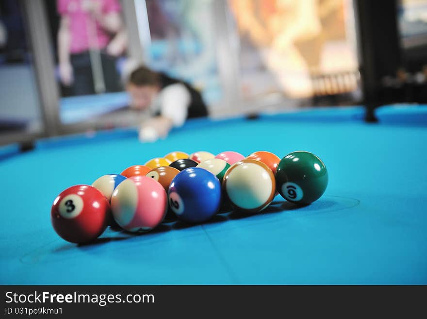 Young man play pro billiard game