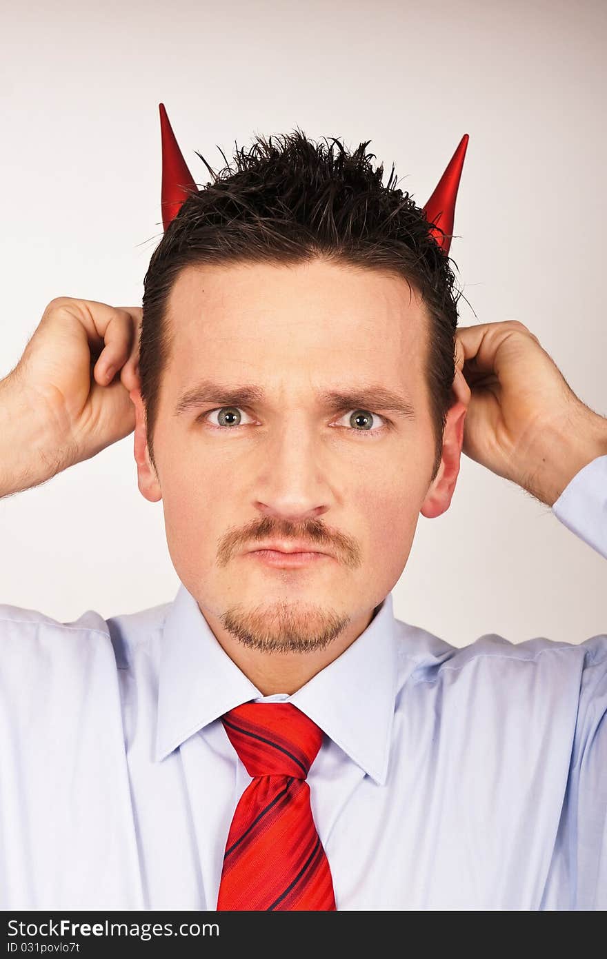 Young man with horns on his head. Young man with horns on his head