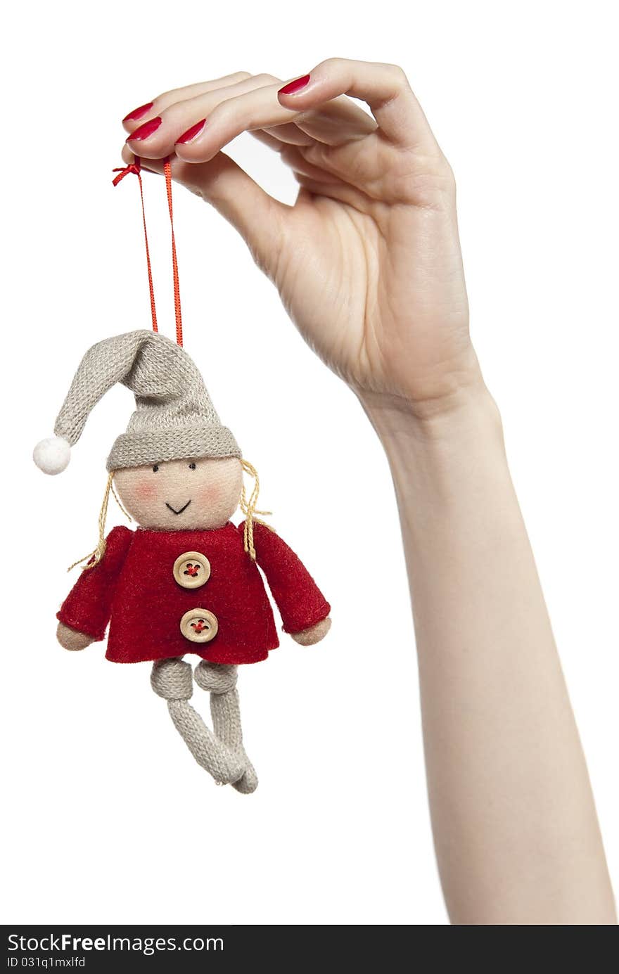 Studio photo of woman'shands playing with puppet. Dwarf on the white background. Studio photo of woman'shands playing with puppet. Dwarf on the white background.