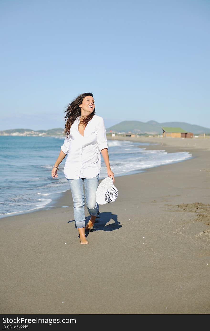 Happy young woman relax onbeautiful beach at morning. Happy young woman relax onbeautiful beach at morning