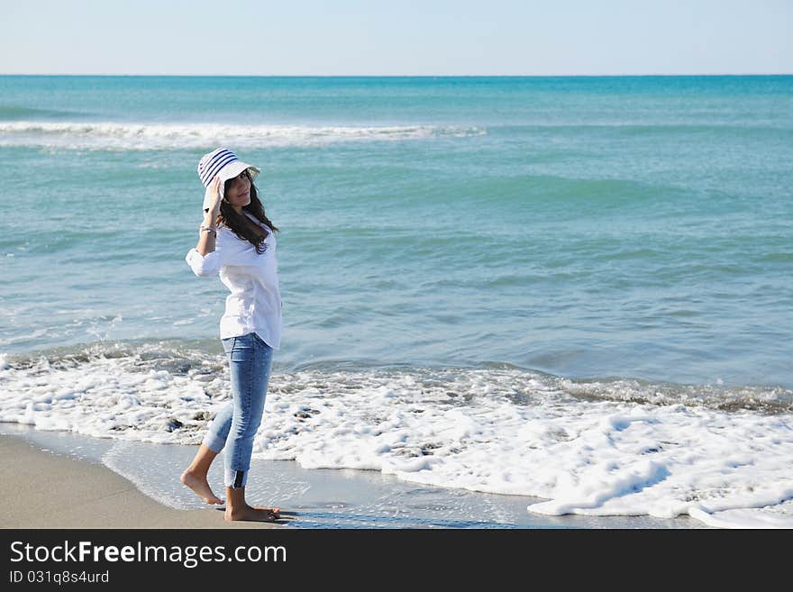 Happy young woman relax onbeautiful beach at morning. Happy young woman relax onbeautiful beach at morning