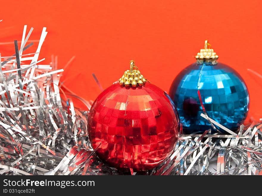 Christmas baubles and glitter toned in red