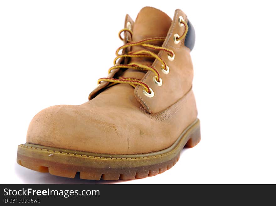 A pair of hiking boots isolated on white background. Shallow depth of field