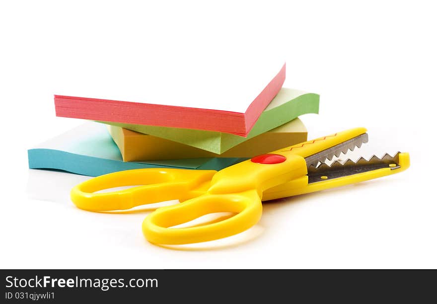 Scissors and paper for notes, white background