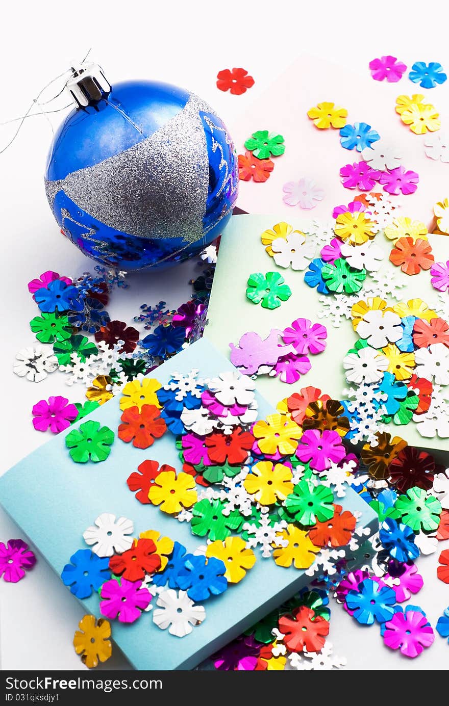 Confetti, Christmas toy and office paper, white background