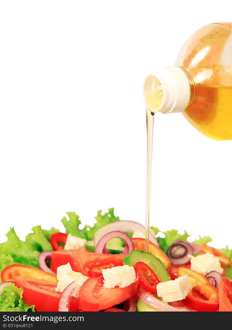 Summer  salad  and  pouring  oil