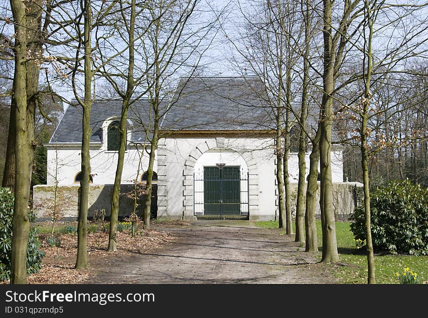 The entrance of a small estate in the woods