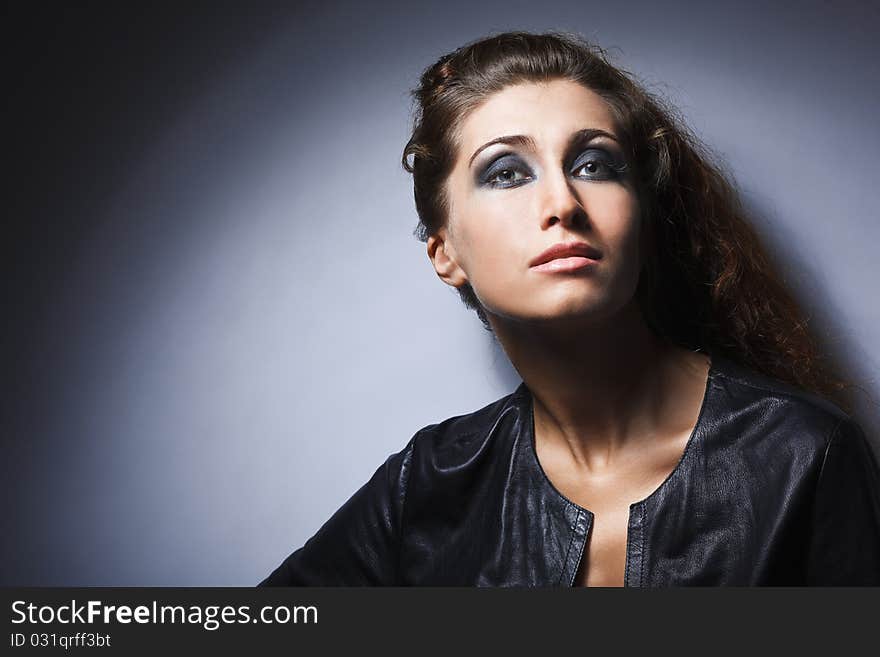 Studio portrait of pretty fashionable girl