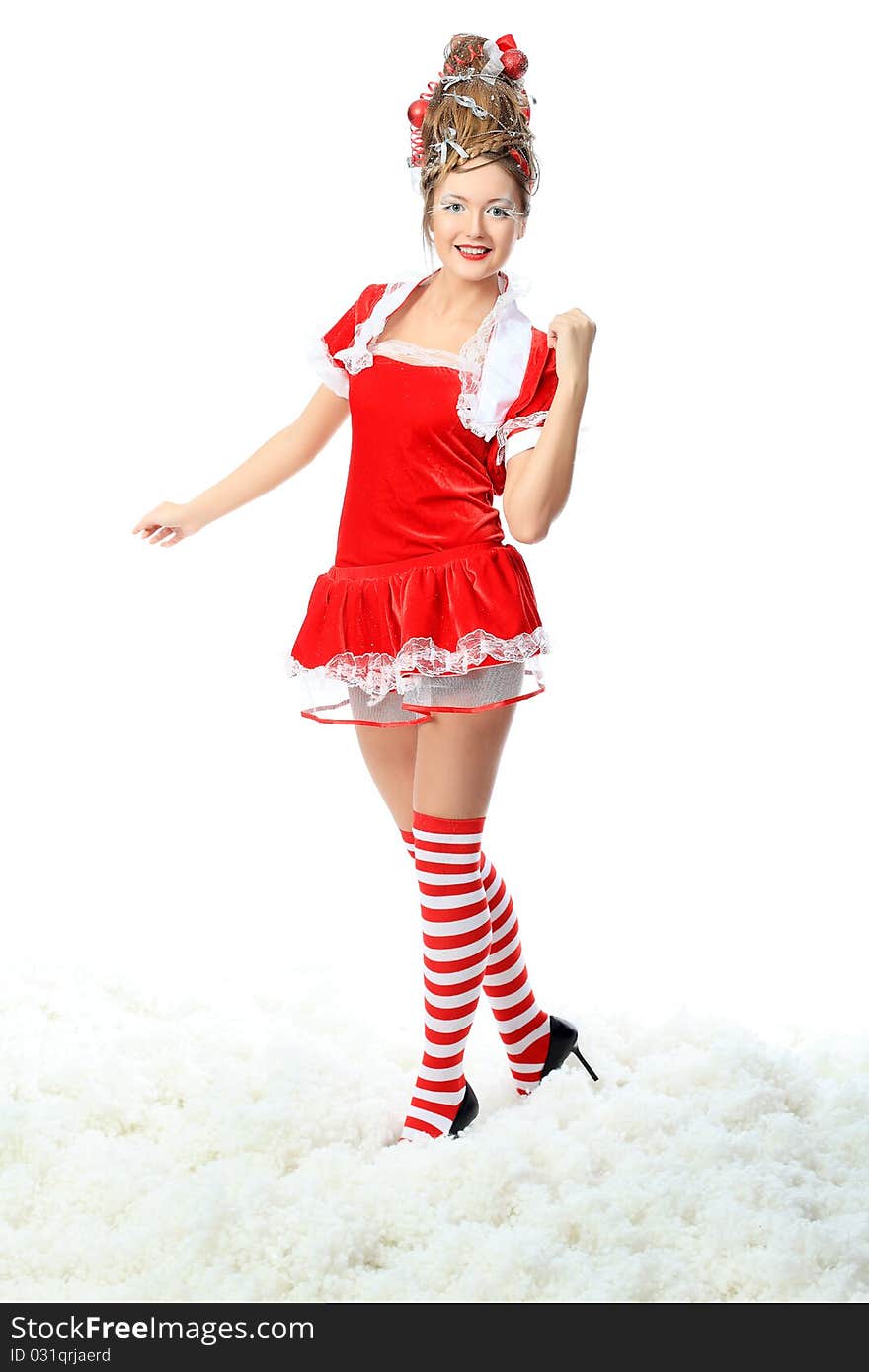 Beautiful young woman in Santa Claus clothes, isolated over white background. Beautiful young woman in Santa Claus clothes, isolated over white background.