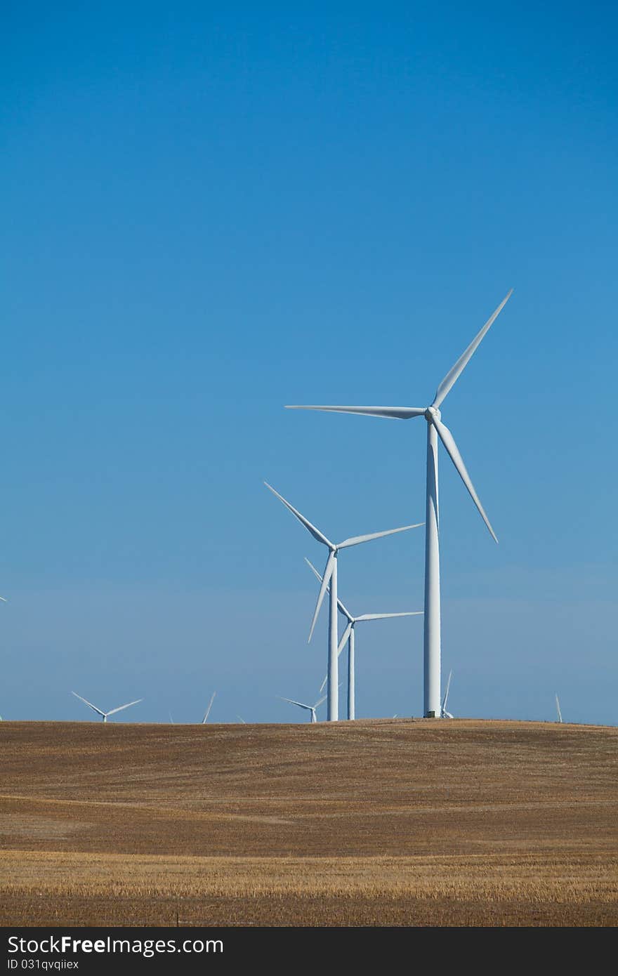 A wind farm in rolling foothills