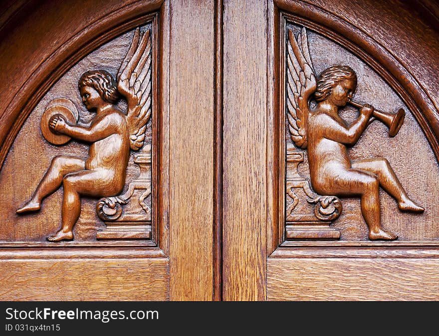 Angels on wooden door