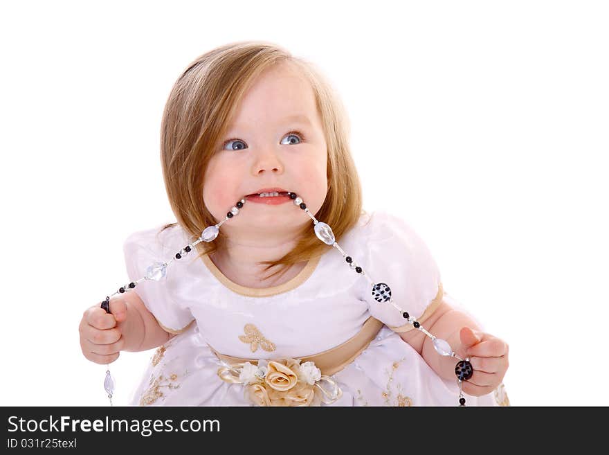 Adorable Baby Girl playing with beads isolated on white