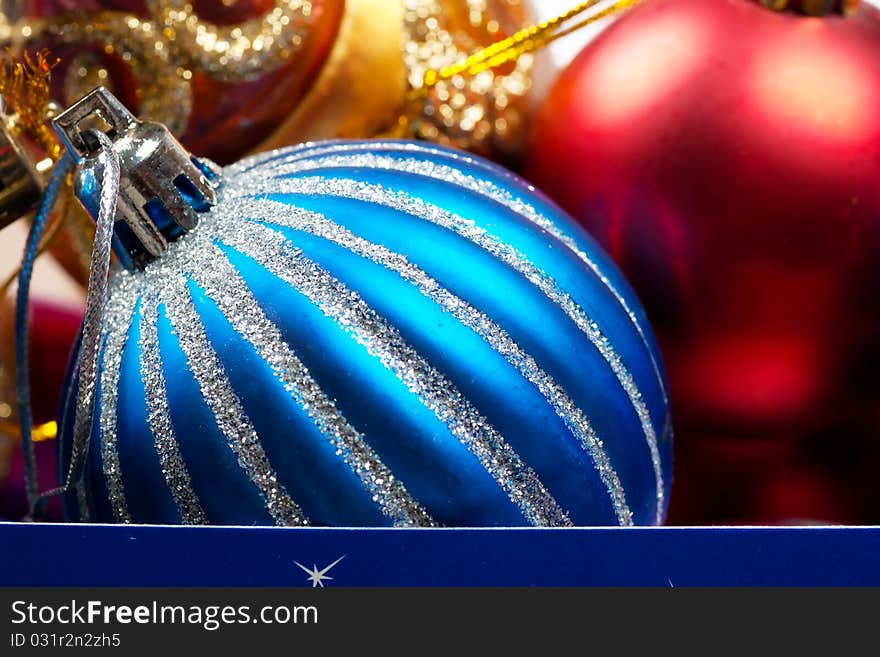 Colorful christmas decorations in a box