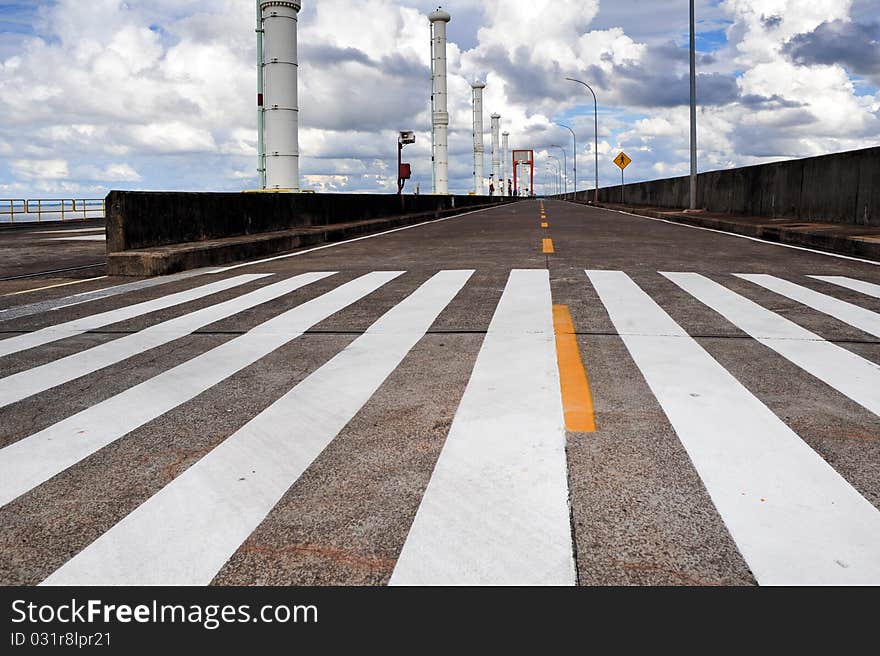 Top of ecological power plant dam roud with pedestrain cross over. Top of ecological power plant dam roud with pedestrain cross over