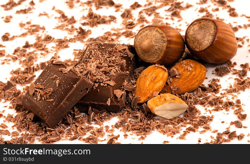 Chocolate pieces with shavings and whole almonds with two in their shells