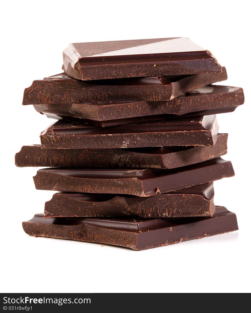 Stack of rich dark chocolate on a white background. Stack of rich dark chocolate on a white background