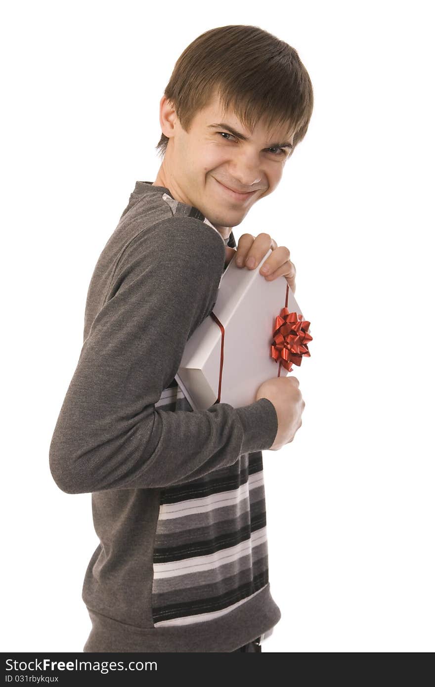 Handsome smiley man holding gift. isolated on white background