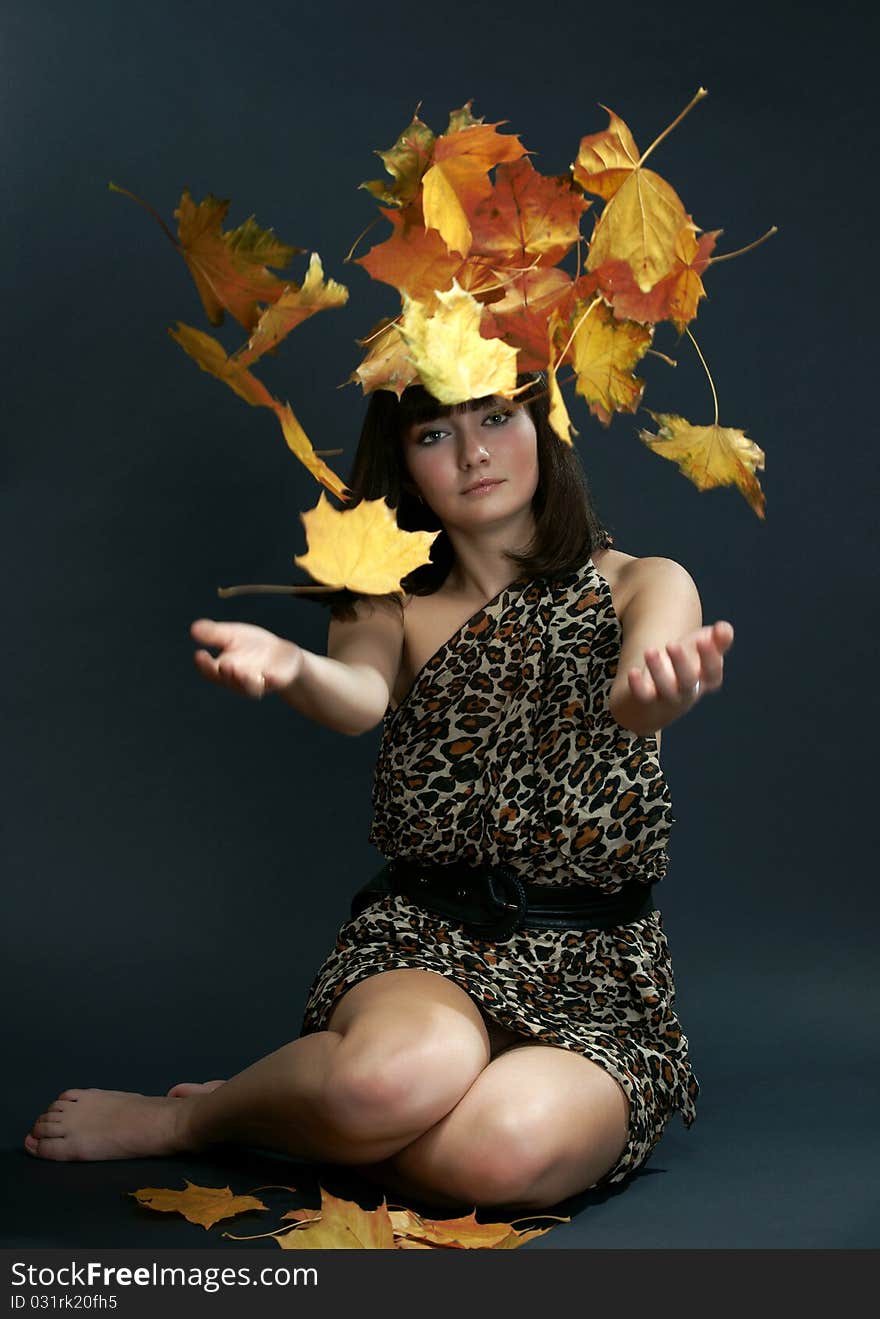 The girl with falling maple leaves