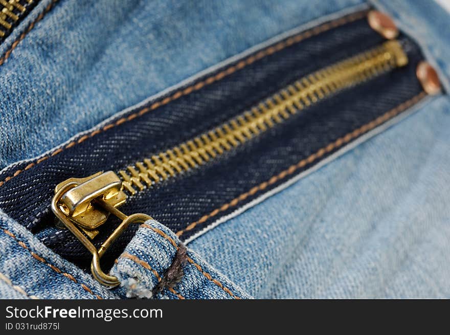 Closeup of a zipped pocket of jeans. Closeup of a zipped pocket of jeans