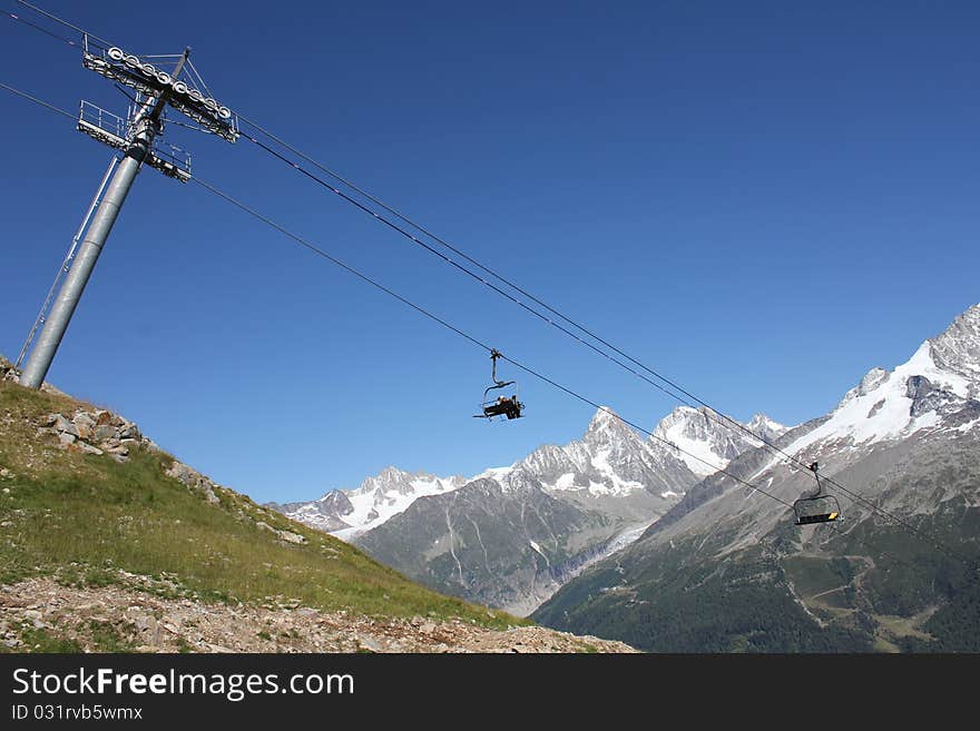 Ski tow and mountain and sky blue. Ski tow and mountain and sky blue