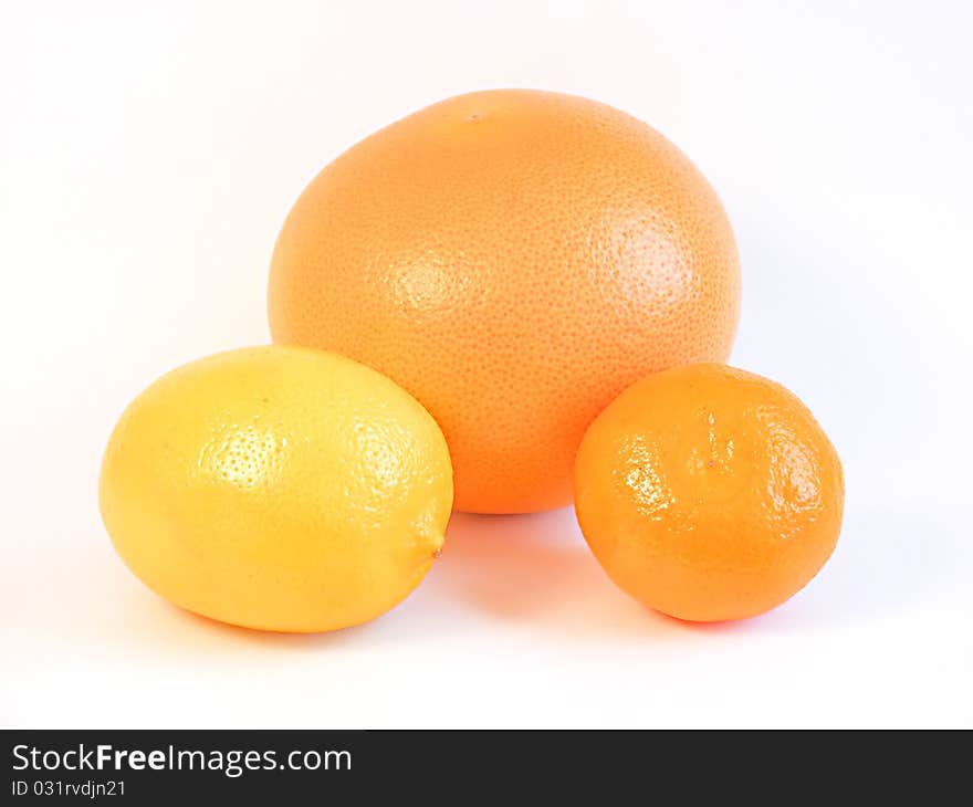 Three healthy citrus fruits isolated on white background