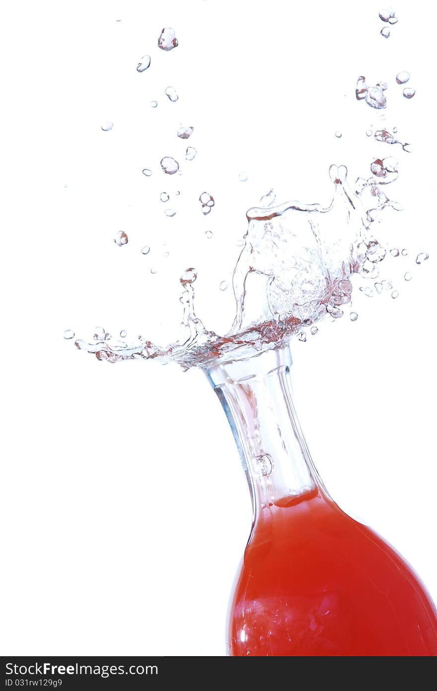 Red drops shooting out of a bottle