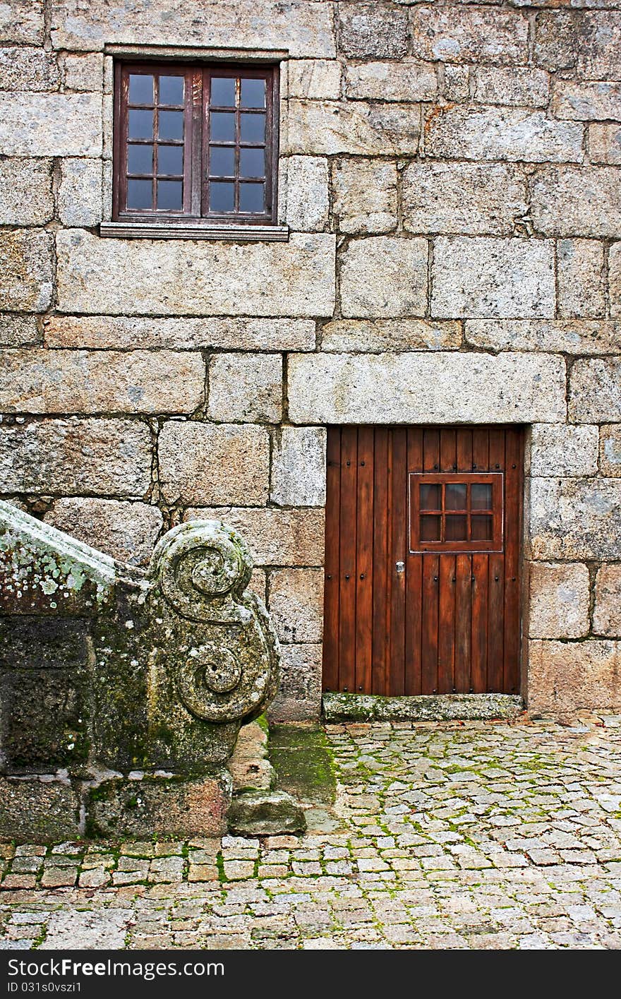 Detail of a very old house facade. Detail of a very old house facade