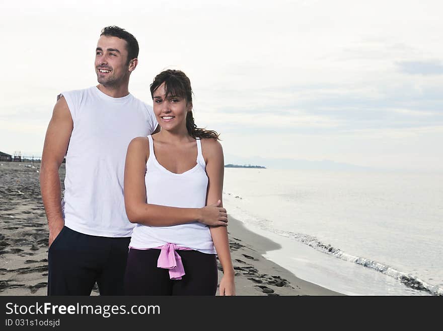 Happy young couple in white clothing  have romantic recreation and   fun at beautiful beach on  vacations. Happy young couple in white clothing  have romantic recreation and   fun at beautiful beach on  vacations