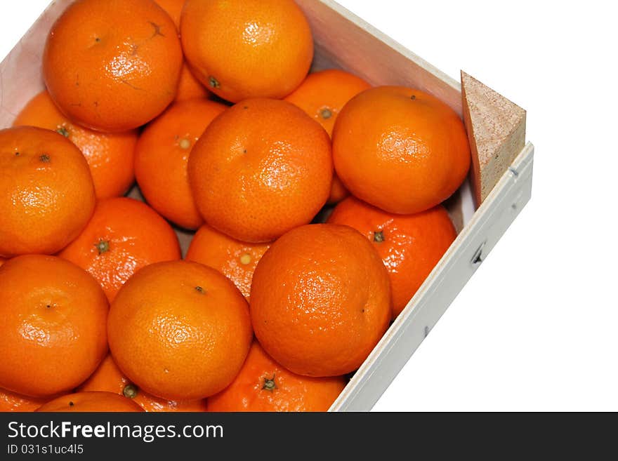 An wooden box with oranges. An wooden box with oranges