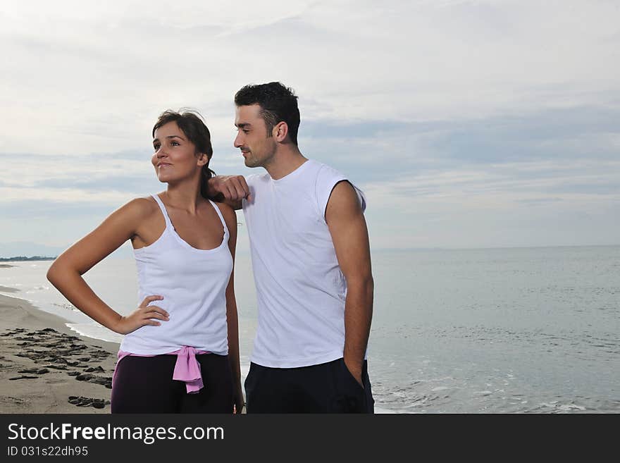 Happy young couple have fun at beautiful beach