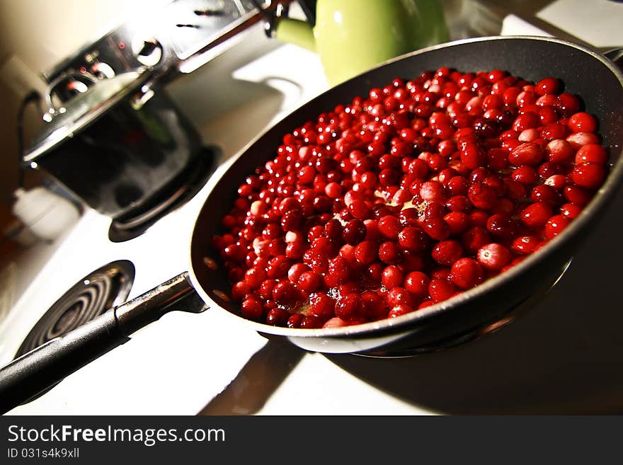 Cooking Cranberries on Thanksgiving Day.