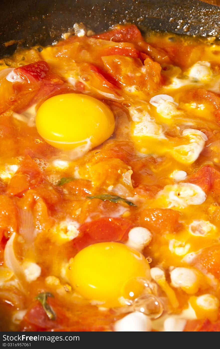 Fried eggs and tomatoes