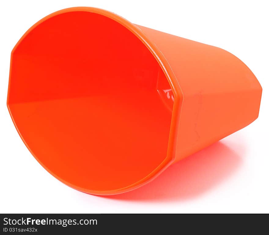 Small orange plastic garbage bin over white background. Clean unused.