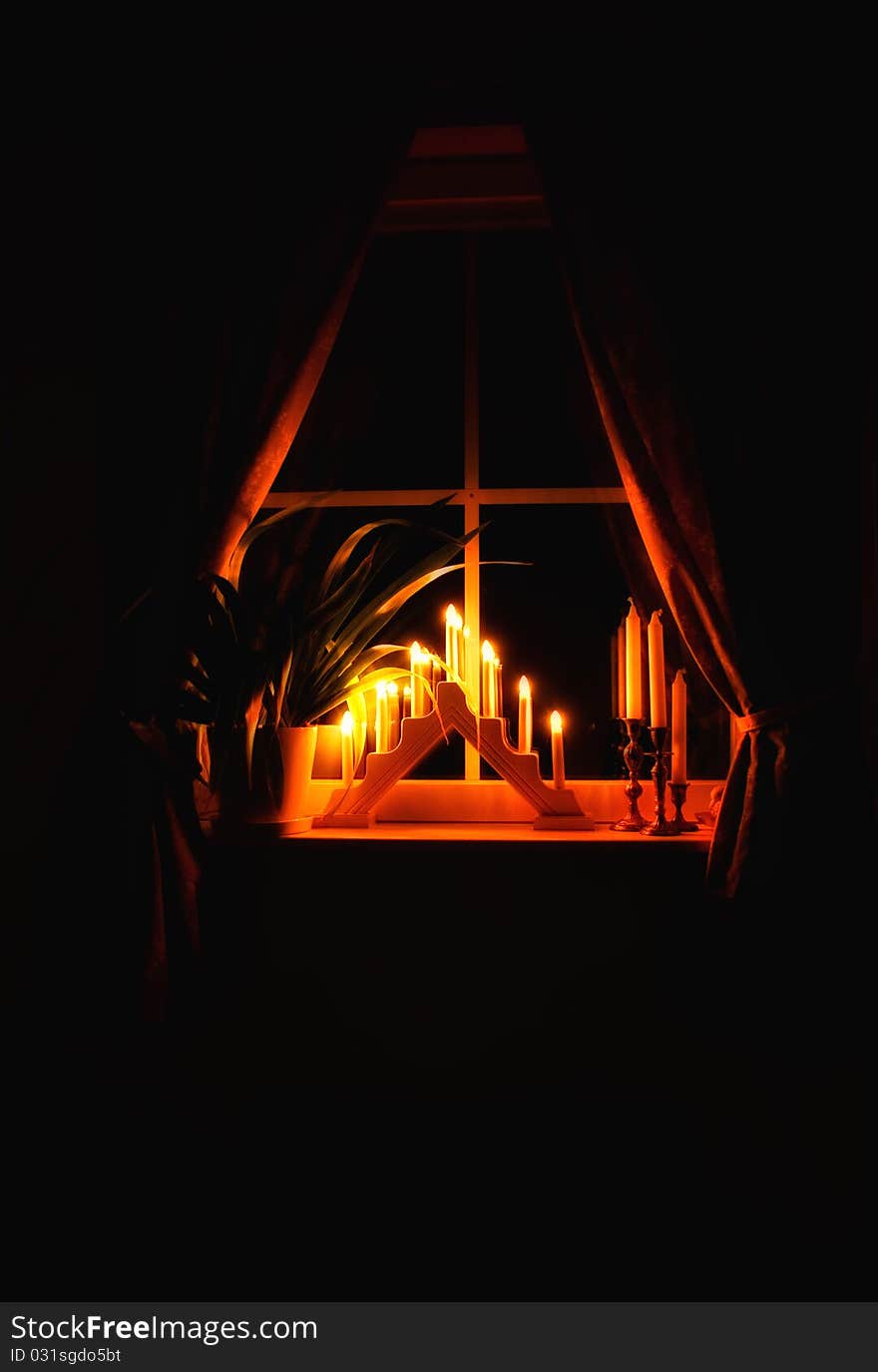 The lights from candlesticks in the evening makes the spirit warm and cozy. The lights from candlesticks in the evening makes the spirit warm and cozy.