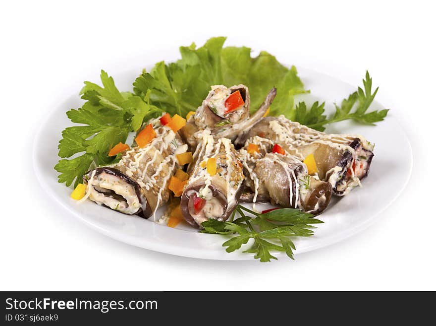 Baked Eggplant rolls stuffed Tomato and Dressed with Parsley. Over white background