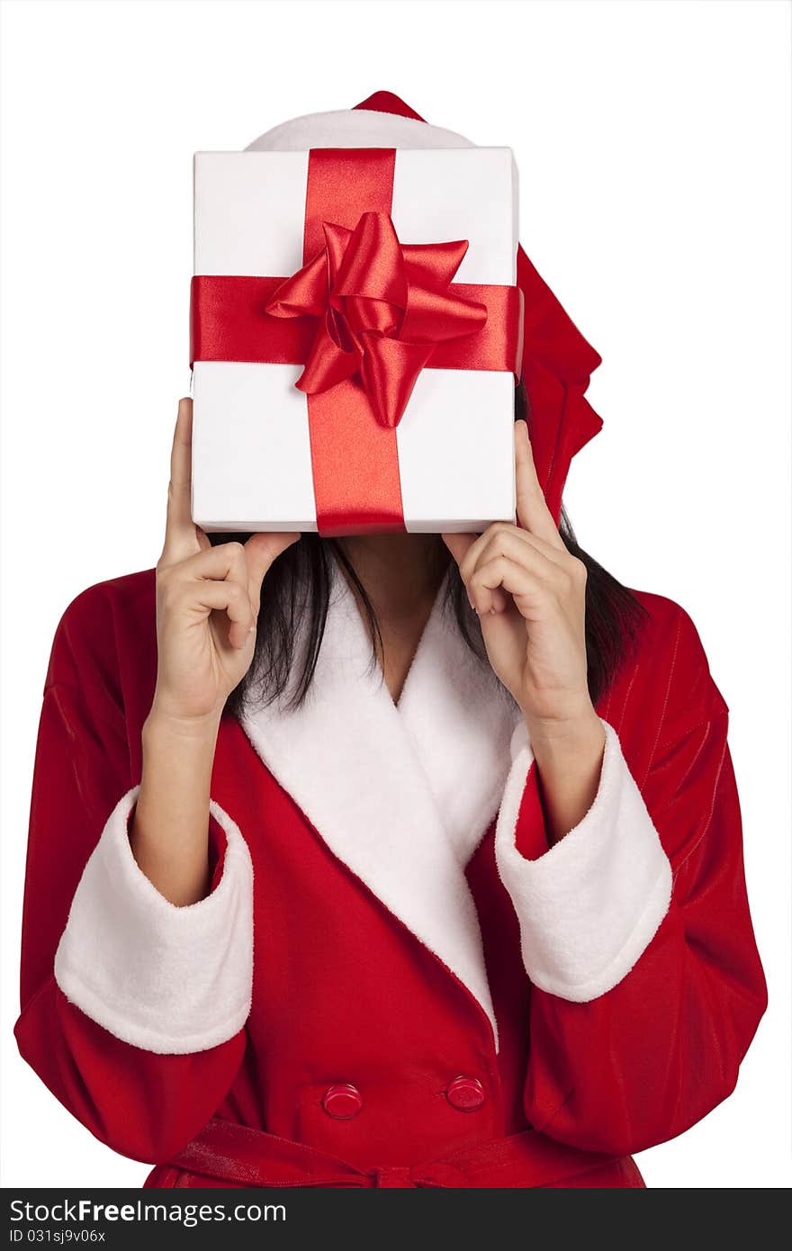 Young Santa covering her face by a gift box isolated on white