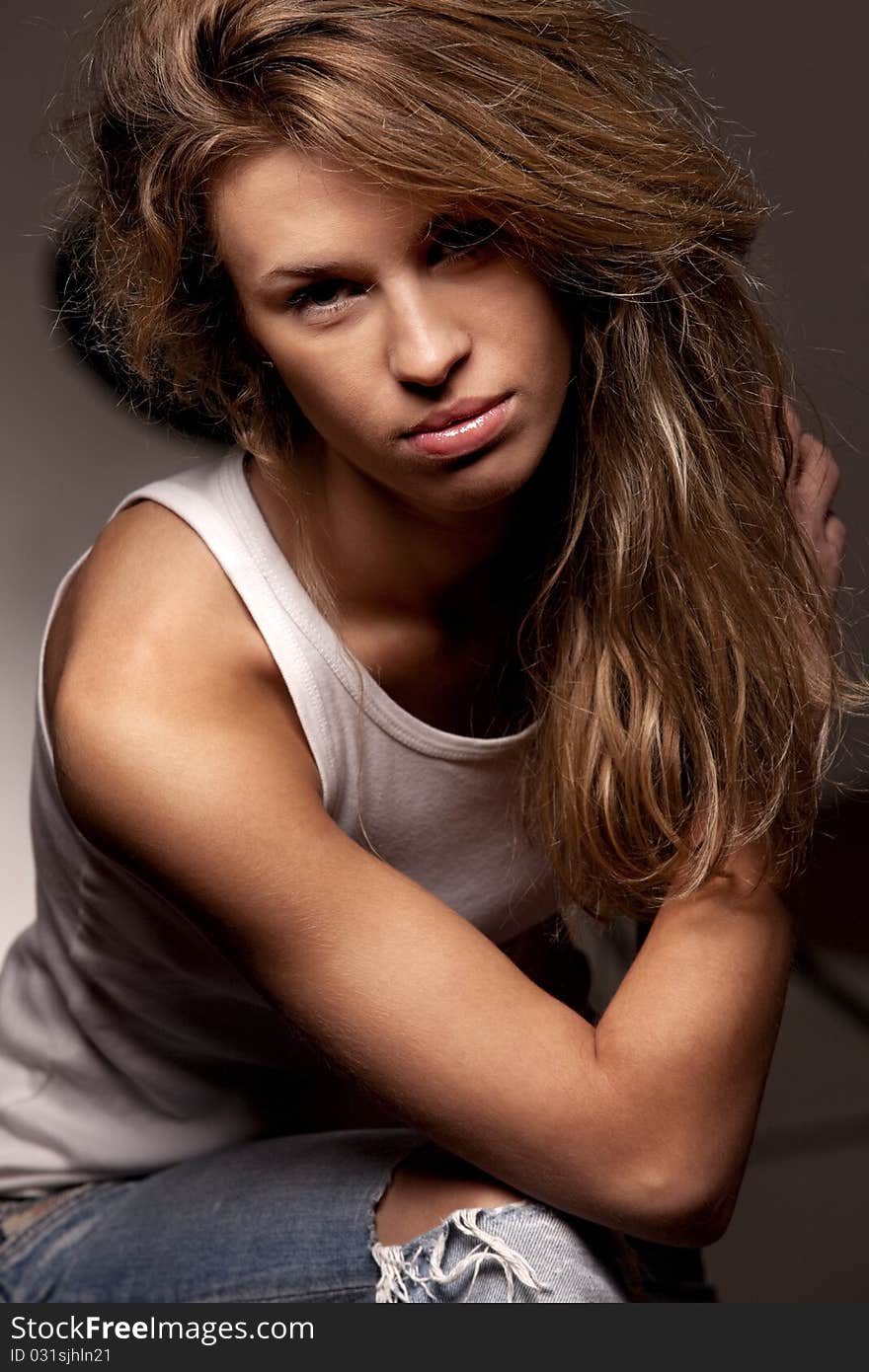 Girl In White T-shirt And Denim