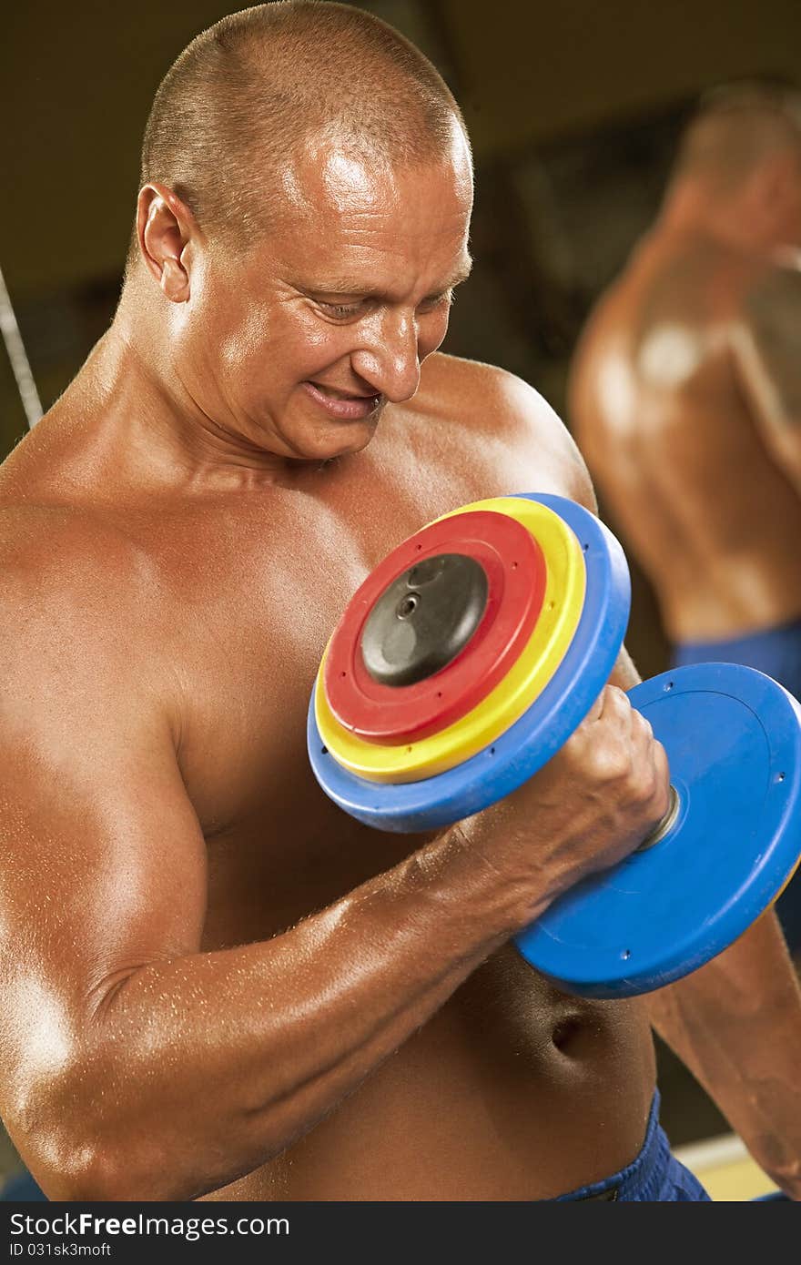 Body builder lifting weights