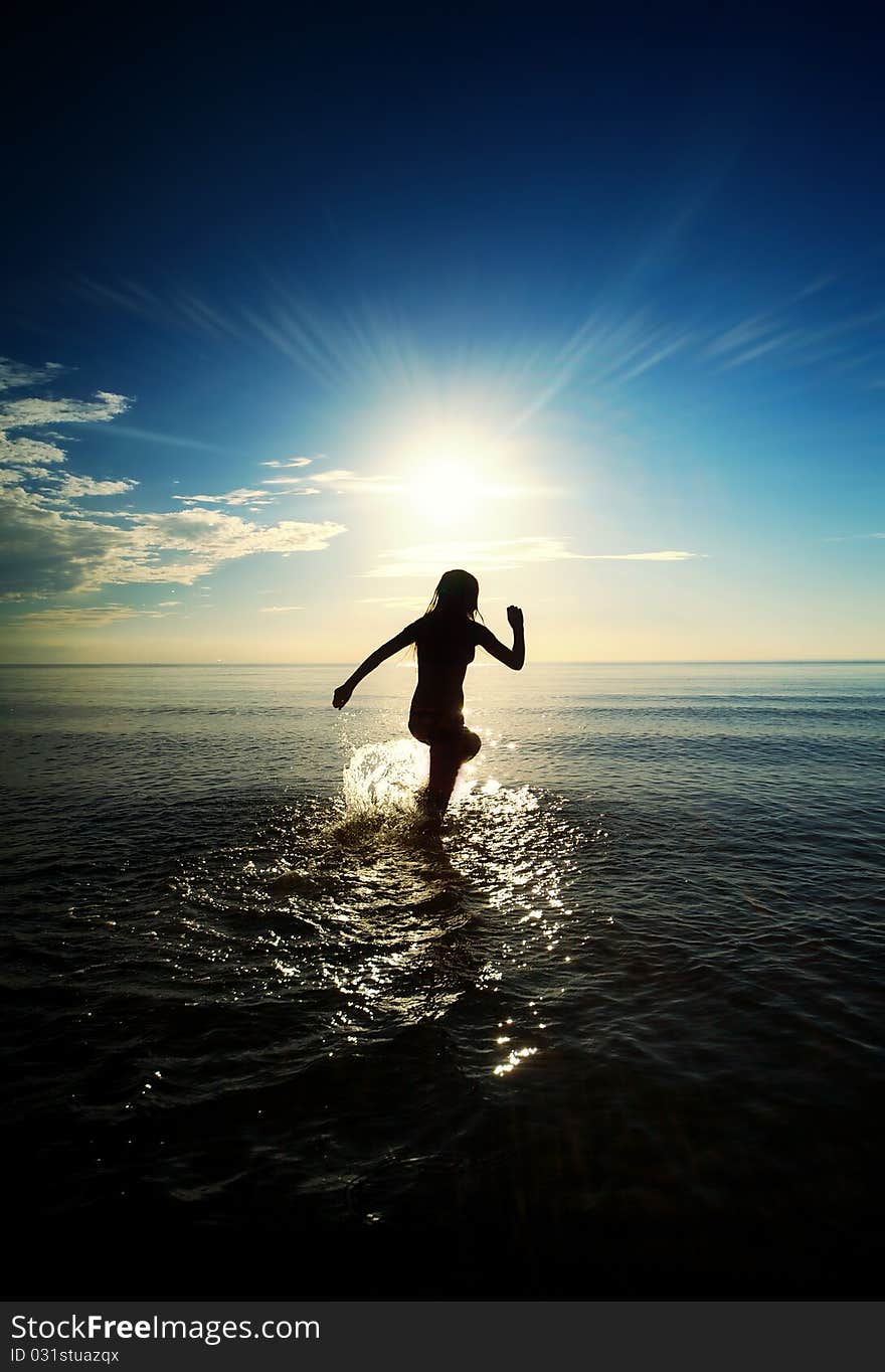 Girl running in the sea