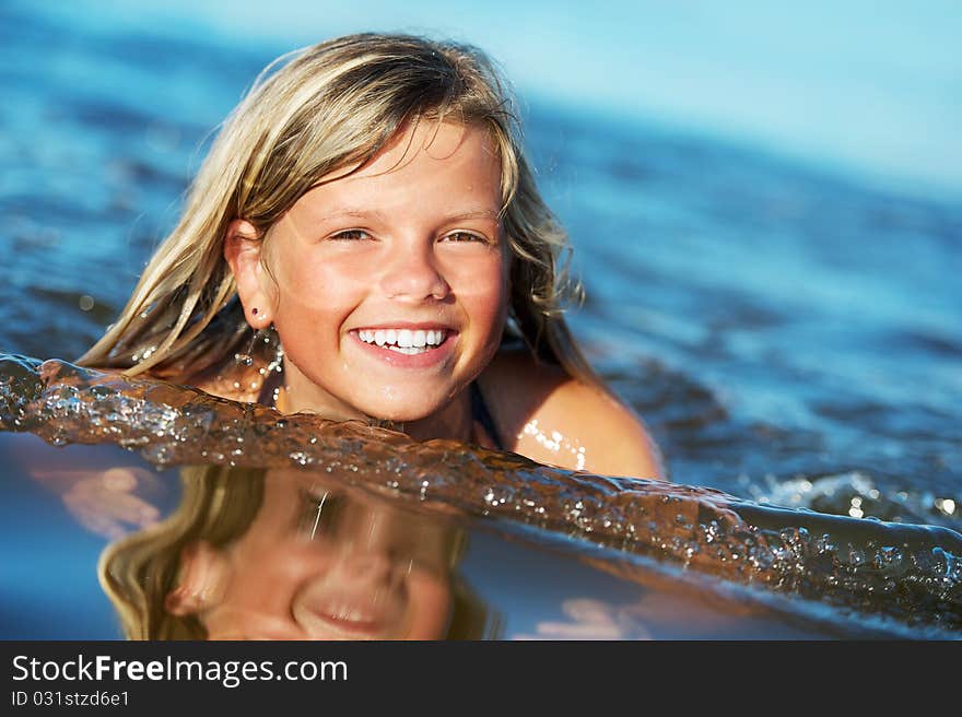 Picture Of A Happy Girl In The Water