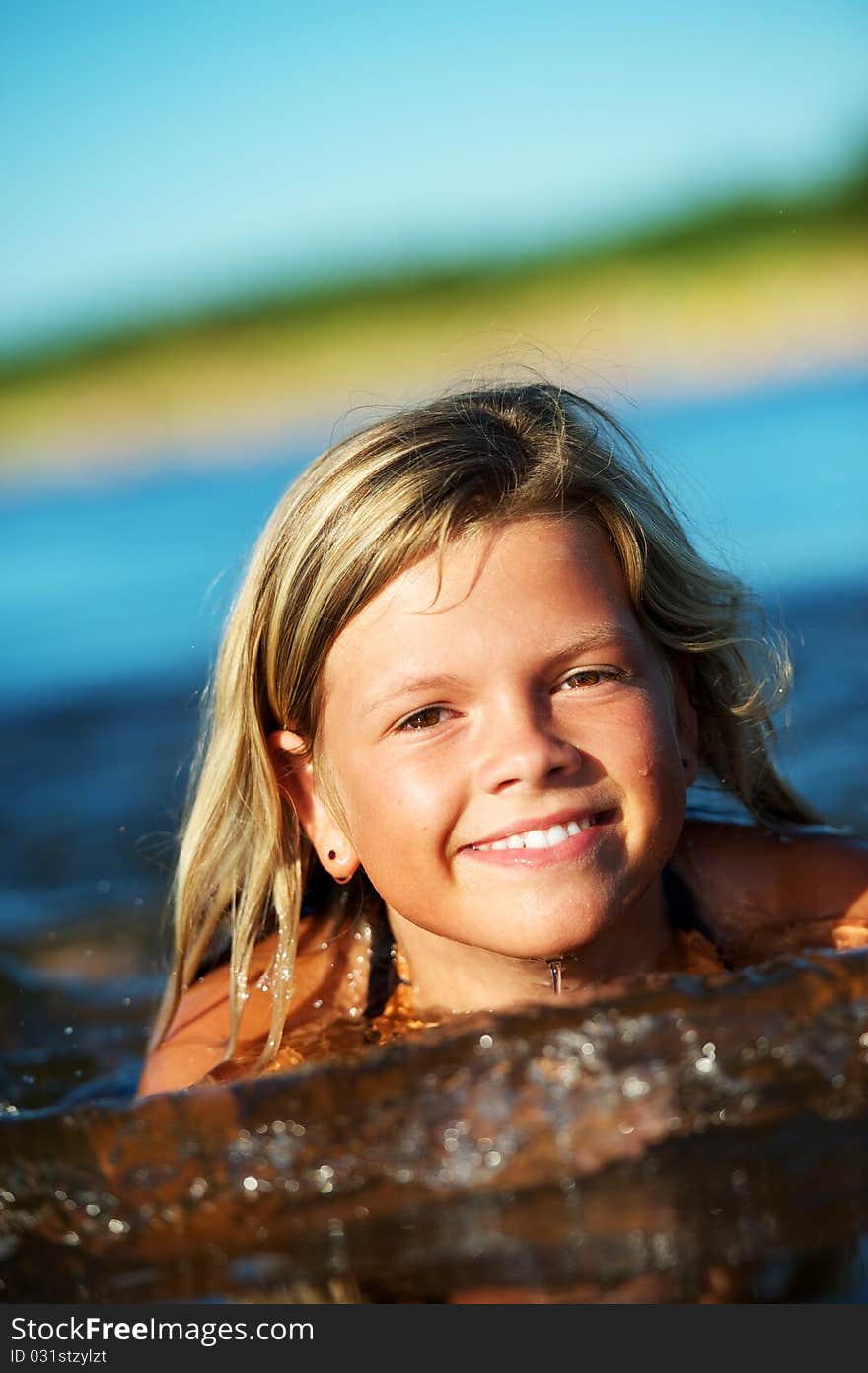 Happy girl swimming in the water. Happy girl swimming in the water