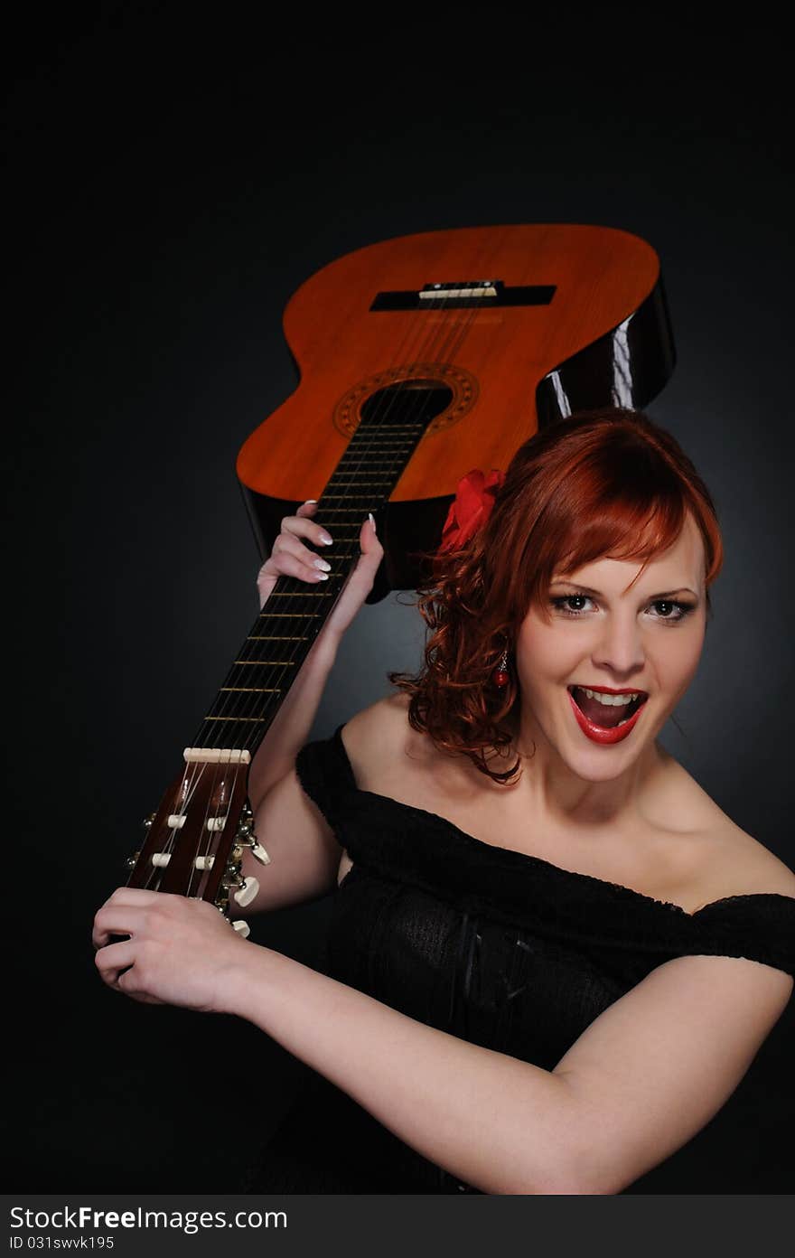 Redhead Woman With Guitar