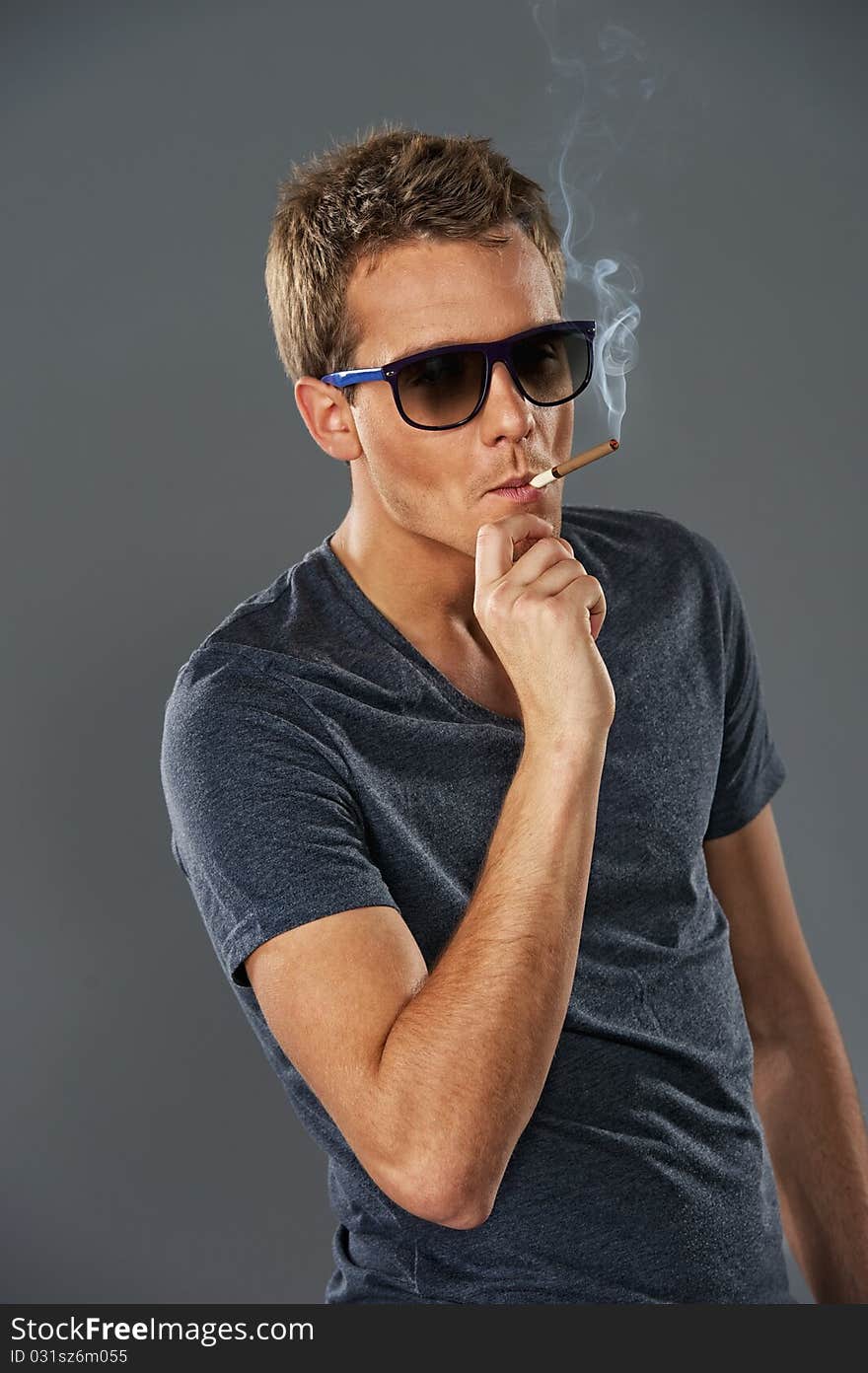 Young stylish man smoking