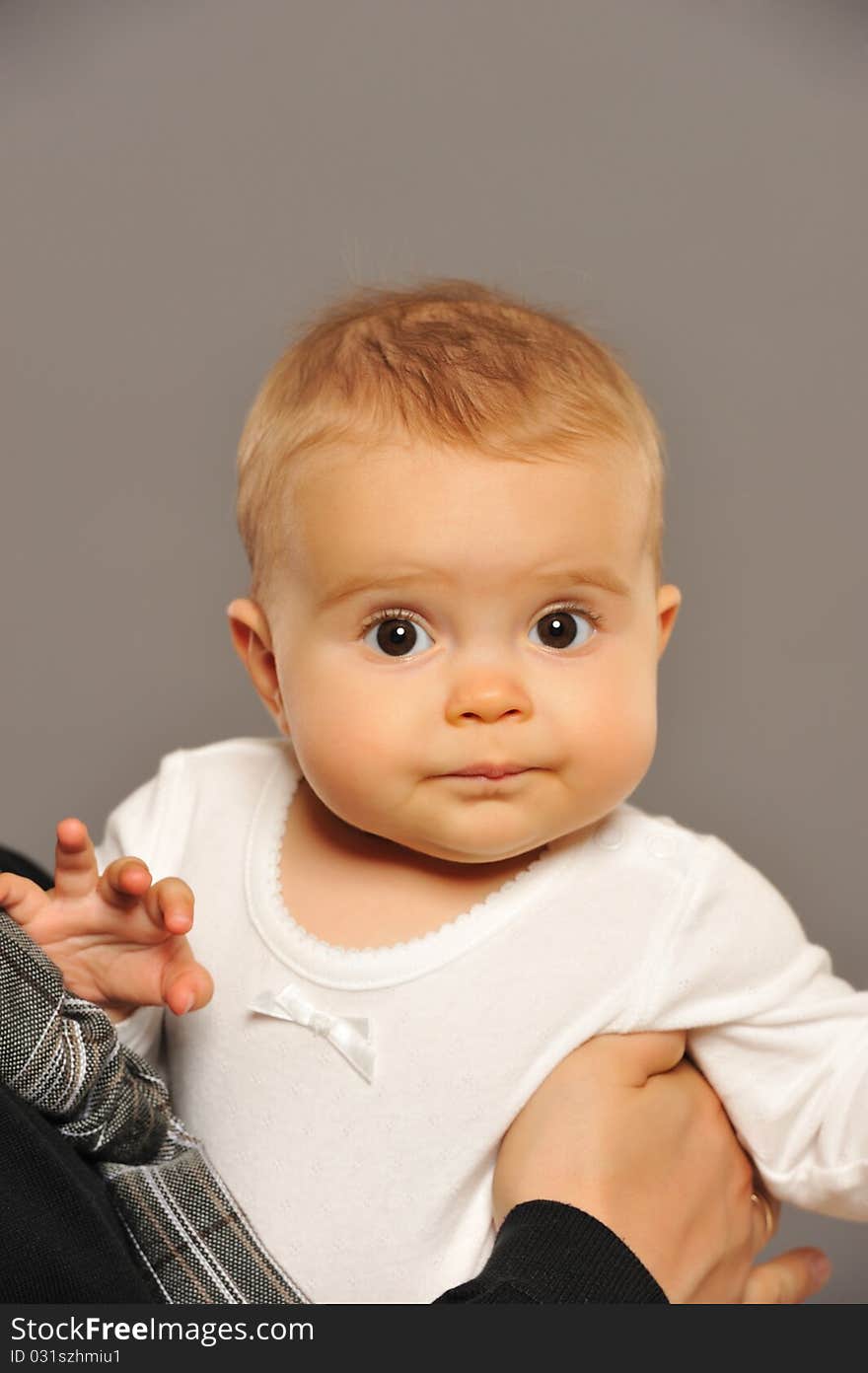 Adorable baby isolated on grey background