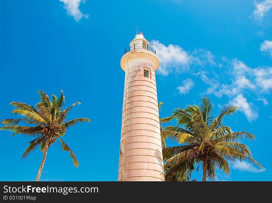 Beautiful lighthouse on the shore of the Indian Ocean