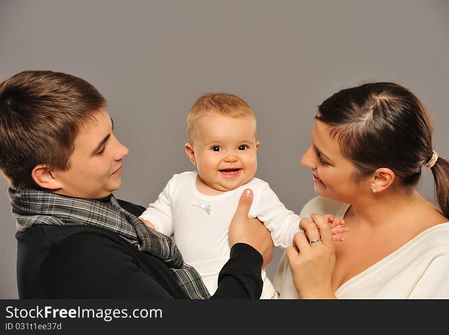 Happy family isolated on grey background