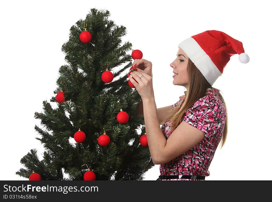 Woman decorate a christmas tree